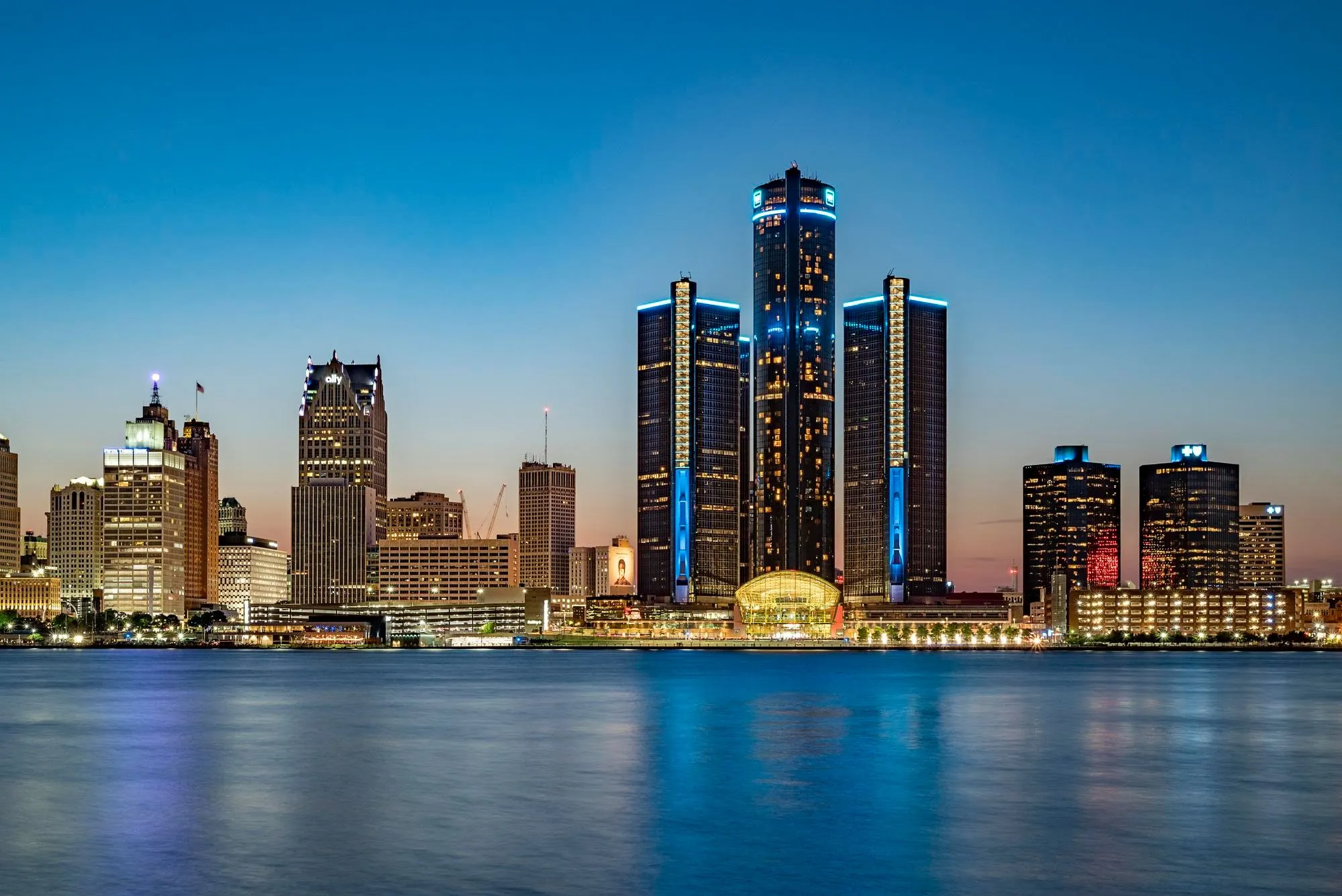 The downtown Detroit skyline and riverfront at dusk, where DITA Pro Clean maintains commercial buildings