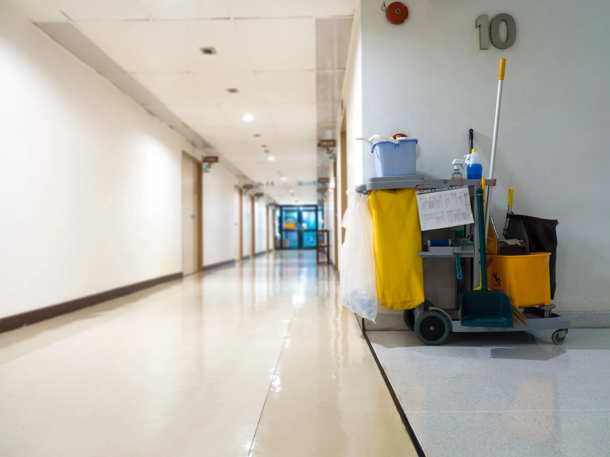 DITA Pro Clean janitorial cart with mop, bucket and supplies in the corridor of a Metro Detroit office building