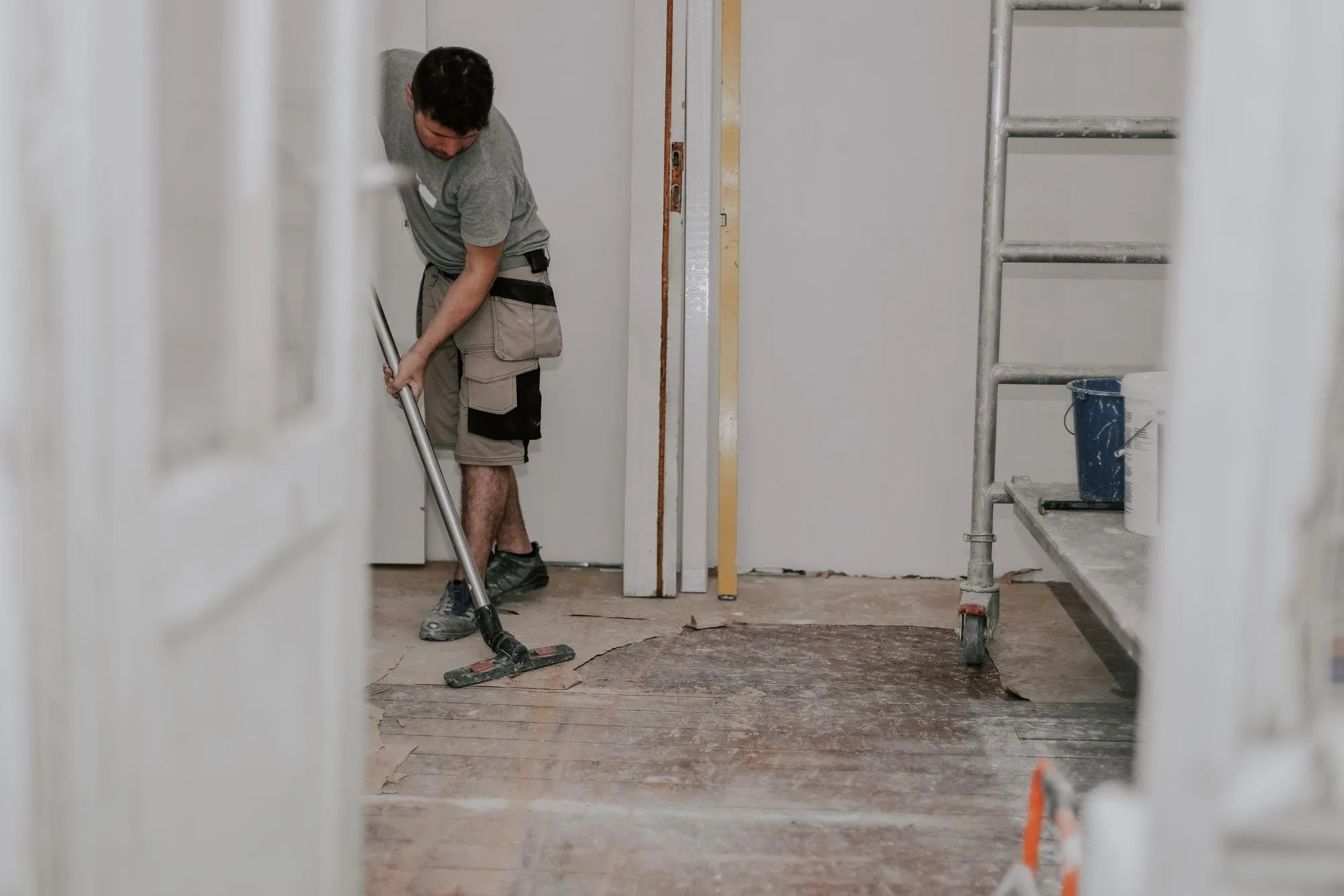 DITA Pro Clean cleaner clearing construction debris and drywall dust from the floor of a Macomb Township renovation
