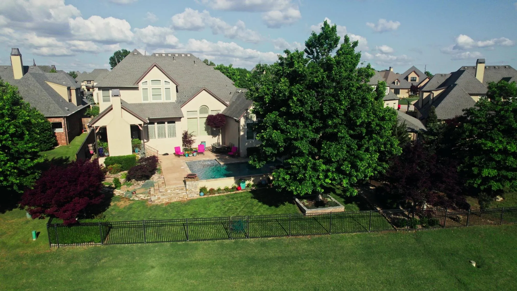 Aerial view of a large home with a pool on a wooded subdivision lot, typical of the Rochester Hills, Michigan properties DITA Pro Clean serves